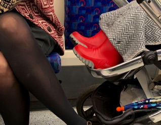 Red wellies on the tube